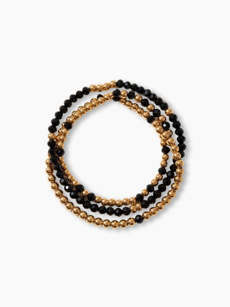 Trio de bracelets fins perles dorées et verre noir Louise, acier inoxydable